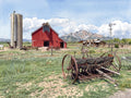 Impressionist-style Digital Luminism watercolor of an antique rusted cultivator in the foreground at the Agricultural Heritage Center in Longmont, Colorado, with the Heritage Barn, windmill, and Long's Peak rendered in the combined style of Renoir and Sargent.