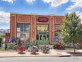 A Digital Luminism watercolor of Cheese Importers at 103 Main Street, Longmont, Colorado, rendered in the combined styles of Renoir and Sargent with vibrant Colorado wildflowers and a brilliant blue Rocky Mountain sky.