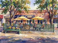 Vibrant Renoir-style watercolor of The Old Oak Coffeehouse patio, featuring yellow umbrellas as basins of sunshine and dappled light.